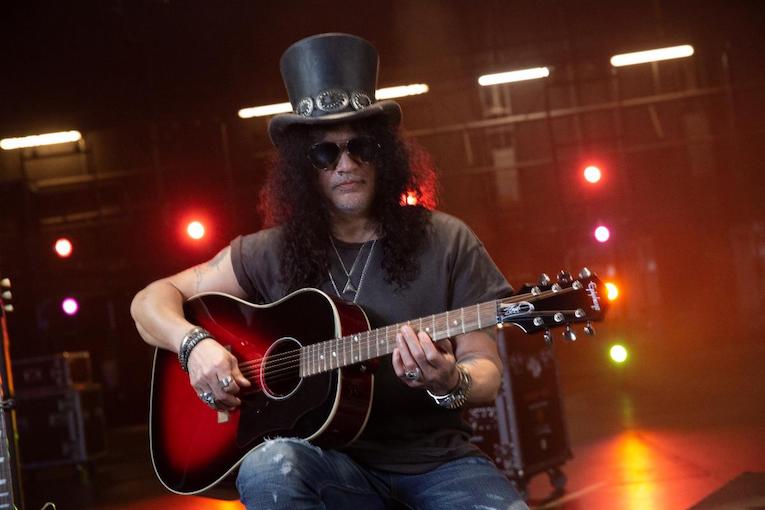 Slash with Epiphone Slash Collection J-45 acoustic guitar photo