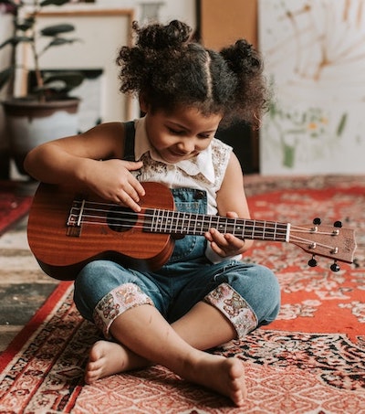 Young female guitarist photo