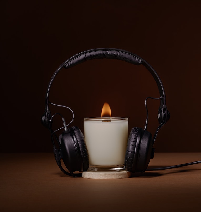 Candle and headphones photo, Can Music Reduce Holiday Stress?