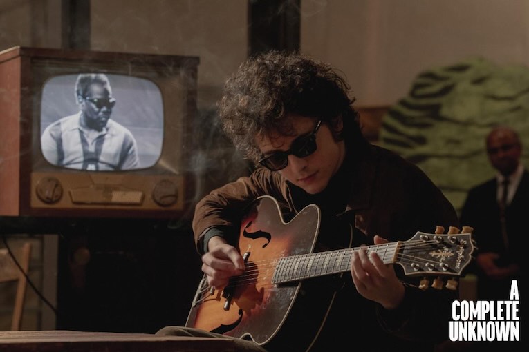 Gibson Partners with Searchlight Pictures for ‘A Complete Unknown’ Starring Timothée Chalamet as Bob Dylan, film still shot 